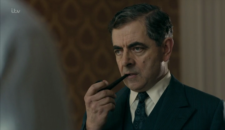 Rowan Atkinson as Maigret